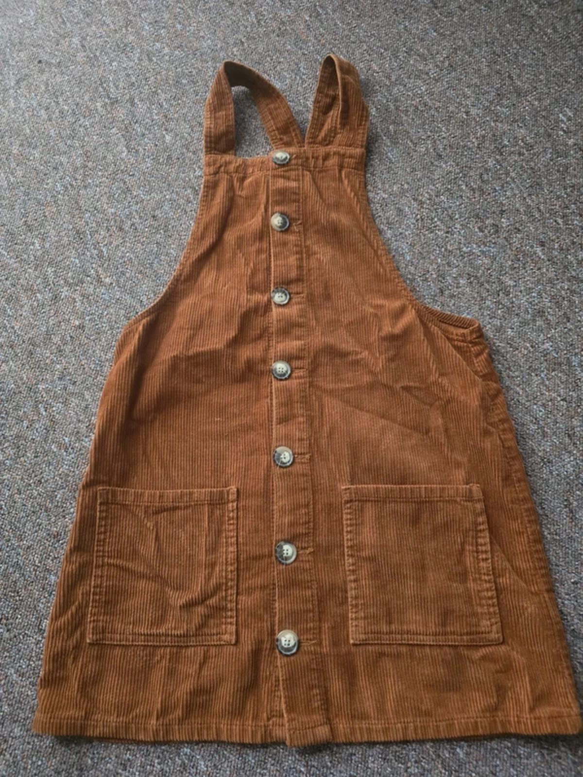 Corduroy brown/tan pinafore dress with button up front and pockets, size 10